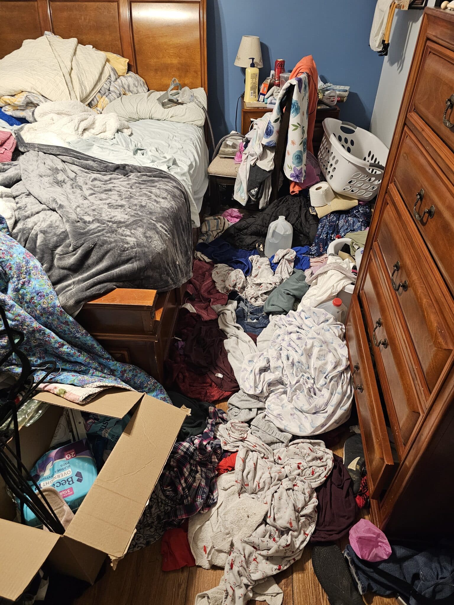Cluttered bedroom before professional hoarding cleanup in Columbus Ohio